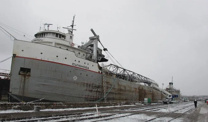 Bulk carrier Cuyahoga alongside the dock after the fire, with a burnt unloading boom